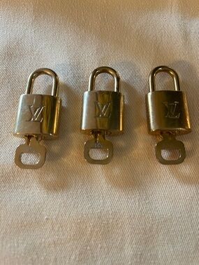 3 Gold Louis Vuitton Padlock and keys
